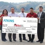 Atkins employees award San Diego MESA Alliance Directors with check.